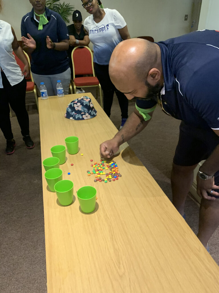 Staff member doing the separation anxiety minute to win it team building challenge
